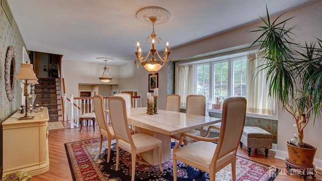 3 Feathertree Ct, Howell, NJ 07731 - dining room with light wood finished floors, stairs, and a chandelier