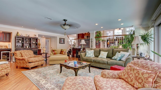 3 Feathertree Ct, Howell, NJ 07731 - living area with light wood finished floors, ornamental molding, recessed lighting, and wine cooler