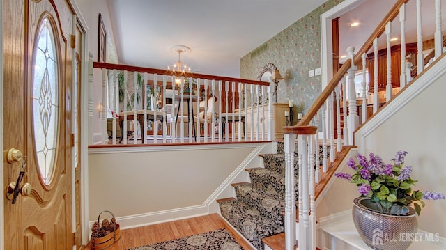 3 Feathertree Ct, Howell, NJ 07731 - foyer with stairway, a chandelier, wood finished floors, and wallpapered walls