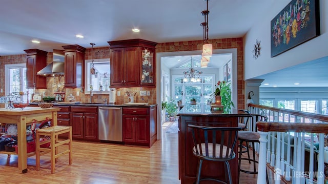3 Feathertree Ct, Howell, NJ 07731 - kitchen featuring dishwasher, wall chimney exhaust hood, healthy amount of natural light, reddish brown cabinets, and recessed lighting