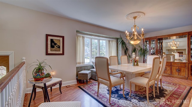 3 Feathertree Ct, Howell, NJ 07731 - dining area featuring a chandelier and light wood-style flooring