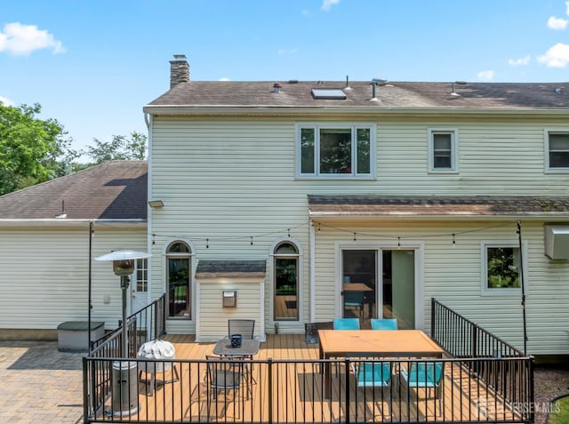 6 Schindler Ct, East Brunswick, NJ 08816 - rear view of house with a chimney, outdoor dining space, a wooden deck, and a patio area