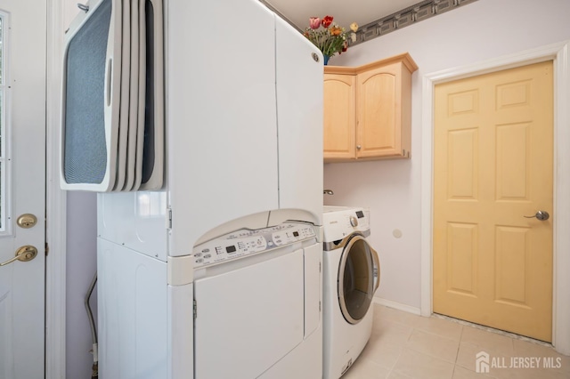 6 Schindler Ct, East Brunswick, NJ 08816 - laundry room featuring light tile patterned flooring, cabinet space, and washer and clothes dryer