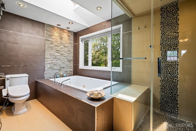 6 Schindler Ct, East Brunswick, NJ 08816 - bathroom featuring a tub with jets, tiled shower, tile walls, tile patterned flooring, and a skylight