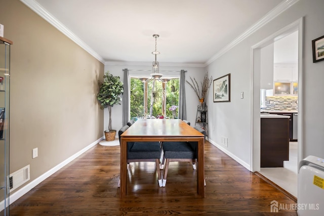6 Schindler Ct, East Brunswick, NJ 08816 - dining room featuring dark wood-type flooring and crown molding
