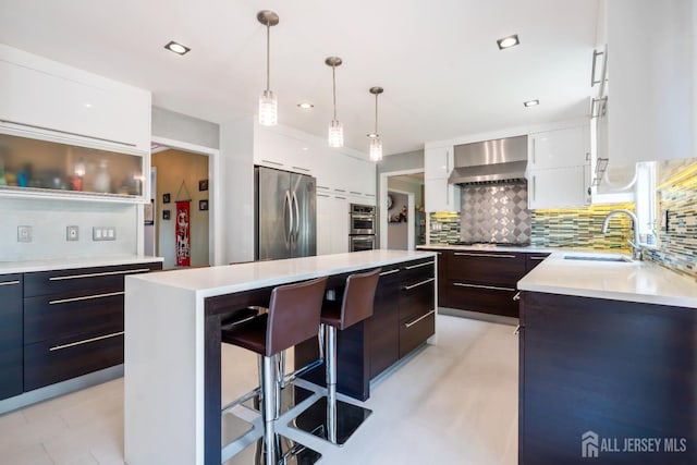 6 Schindler Ct, East Brunswick, NJ 08816 - kitchen featuring stainless steel appliances, modern cabinets, wall chimney range hood, a kitchen island, and light countertops
