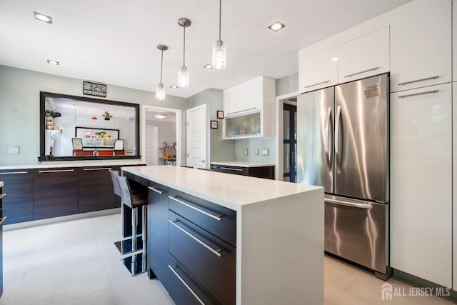 6 Schindler Ct, East Brunswick, NJ 08816 - kitchen with stainless steel refrigerator, modern cabinets, white cabinetry, light countertops, and recessed lighting