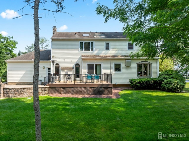 6 Schindler Ct, East Brunswick, NJ 08816 - rear view of property with a wooden deck, a chimney, and a lawn