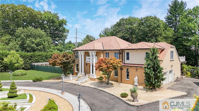 view of front of property with a garage and a front yard