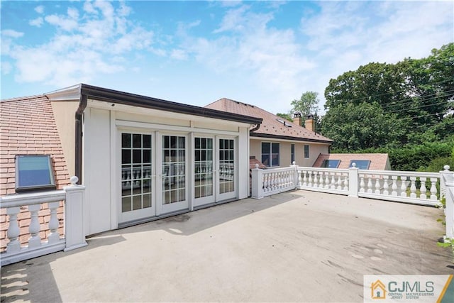 exterior space featuring a patio and a chimney