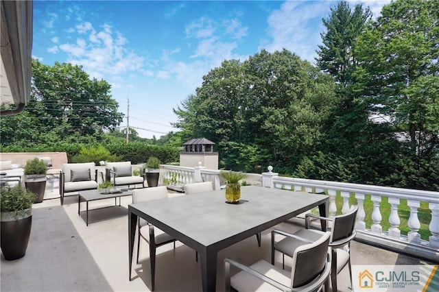 view of patio with outdoor dining area and an outdoor living space