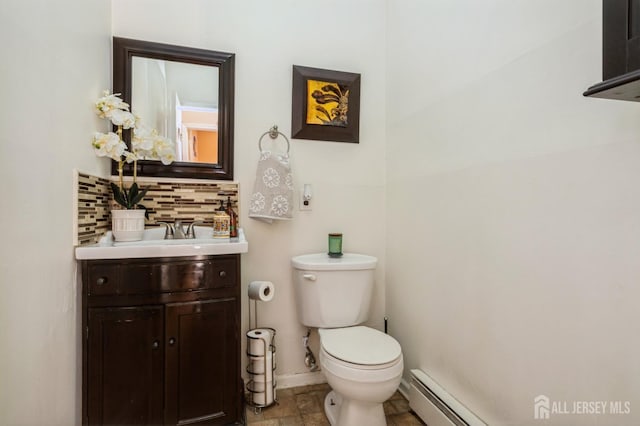 half bathroom with baseboards, decorative backsplash, toilet, a baseboard radiator, and vanity