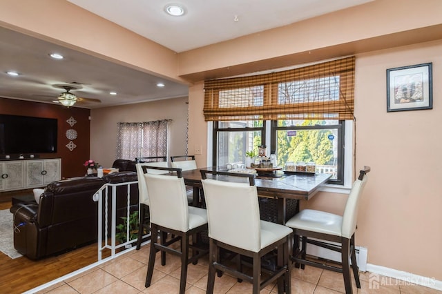 dining space with tile patterned flooring, a baseboard heating unit, recessed lighting, baseboards, and ceiling fan