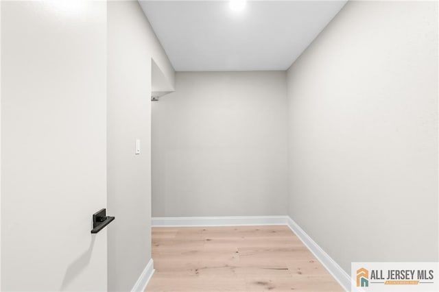 442 Dahlia Plz Unit 442A, Monroe, NJ 08831 - hallway featuring light wood-style floors and baseboards