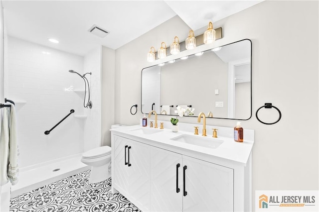 442 Dahlia Plz Unit 442A, Monroe, NJ 08831 - bathroom featuring double vanity, a tile shower, and tile patterned flooring