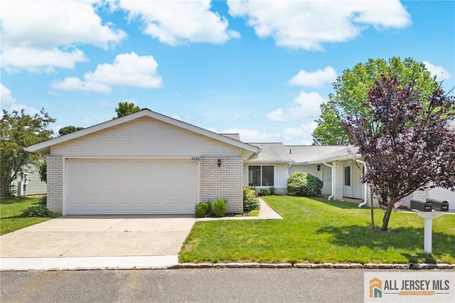 442 Dahlia Plz Unit 442A, Monroe, NJ 08831 - ranch-style home with driveway, a front lawn, an attached garage, and brick siding