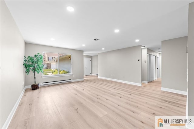 442 Dahlia Plz Unit 442A, Monroe, NJ 08831 - unfurnished living room with a baseboard radiator, light wood-style flooring, and recessed lighting
