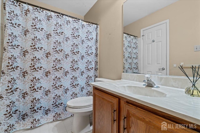 bathroom featuring vanity and toilet