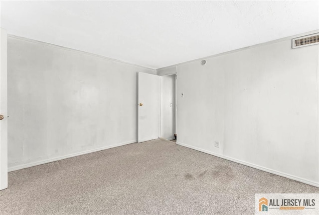 224 2nd St, South Amboy, NJ 08879 - spare room with visible vents, baseboards, and carpet floors
