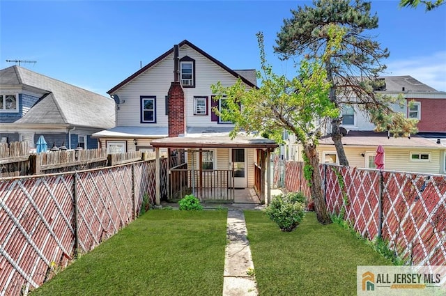 224 2nd St, South Amboy, NJ 08879 - back of house with a porch, a yard, and a fenced backyard