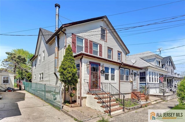 224 2nd St, South Amboy, NJ 08879 - view of front facade featuring fence and entry steps