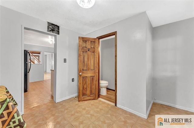 224 2nd St, South Amboy, NJ 08879 - interior space with baseboards and freestanding refrigerator