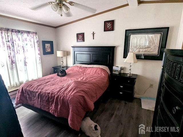 bedroom featuring baseboards, crown molding, a ceiling fan, and wood finished floors