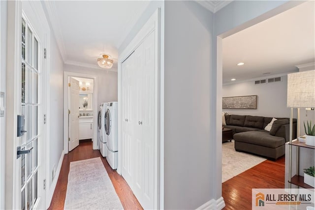 43 S Brook Dr, Milltown, NJ 08850 - laundry room featuring independent washer and dryer, crown molding, wood finished floors, and recessed lighting
