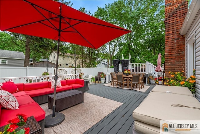 43 S Brook Dr, Milltown, NJ 08850 - wooden deck featuring outdoor dining space, an outdoor living space, and a fenced backyard