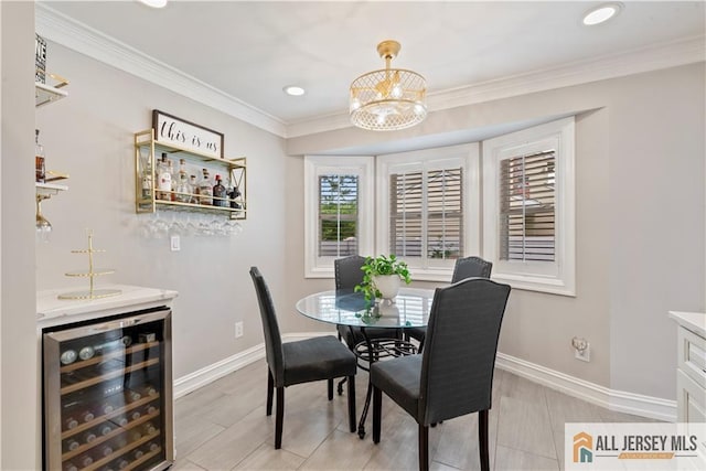 43 S Brook Dr, Milltown, NJ 08850 - dining space featuring wine cooler, a dry bar, a chandelier, recessed lighting, and ornamental molding