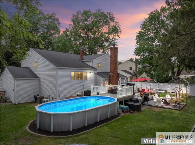 43 S Brook Dr, Milltown, NJ 08850 - pool at dusk with a deck and a storage unit