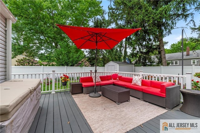 43 S Brook Dr, Milltown, NJ 08850 - wooden deck featuring outdoor lounge area, a storage unit, and a fenced backyard