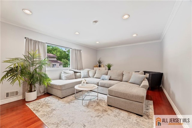 43 S Brook Dr, Milltown, NJ 08850 - living room with wood finished floors, crown molding, and recessed lighting