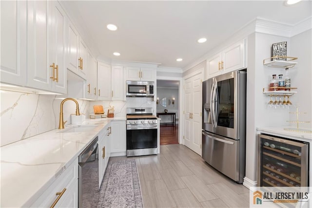 43 S Brook Dr, Milltown, NJ 08850 - kitchen with stainless steel appliances, beverage cooler, white cabinetry, crown molding, and recessed lighting