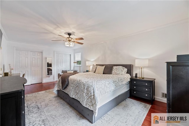 43 S Brook Dr, Milltown, NJ 08850 - bedroom with two closets, ornamental molding, wood finished floors, and ceiling fan