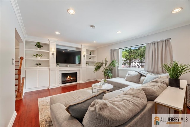 43 S Brook Dr, Milltown, NJ 08850 - living room featuring crown molding, a glass covered fireplace, wood finished floors, and recessed lighting