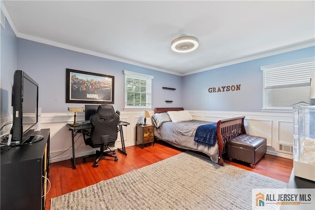 43 S Brook Dr, Milltown, NJ 08850 - bedroom with wood finished floors, ornamental molding, a wainscoted wall, and an office area
