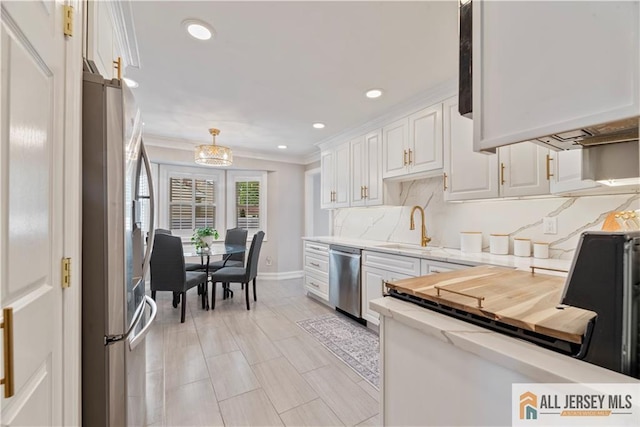 43 S Brook Dr, Milltown, NJ 08850 - kitchen with stainless steel appliances, crown molding, white cabinets, backsplash, and recessed lighting