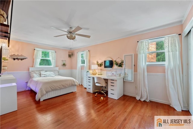 43 S Brook Dr, Milltown, NJ 08850 - bedroom featuring wainscoting, wood finished floors, ornamental molding, a desk, and a ceiling fan