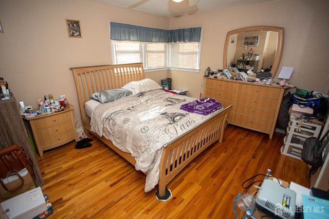 bedroom featuring hardwood / wood-style floors and ceiling fan