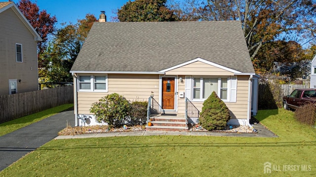 bungalow-style home with a front lawn