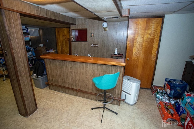 bar featuring wood walls