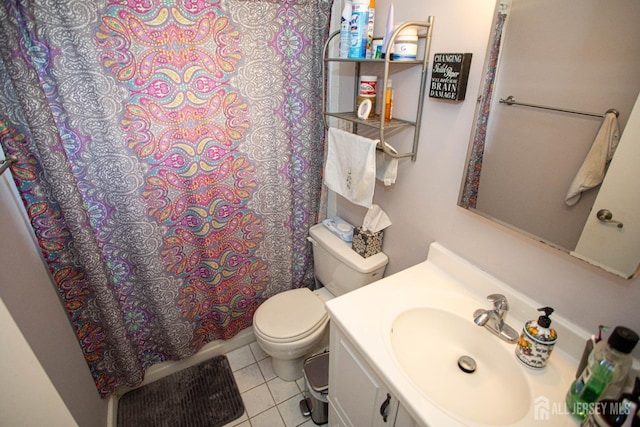 bathroom with tile patterned flooring, vanity, a shower with shower curtain, and toilet