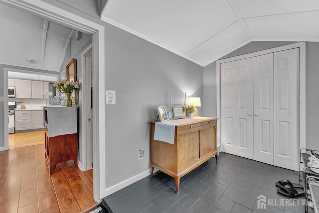 220 Birchwood Dr, Old Bridge, NJ 07735 - interior space with vaulted ceiling, baseboards, backsplash, and a closet