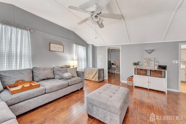 220 Birchwood Dr, Old Bridge, NJ 07735 - living room featuring a ceiling fan, vaulted ceiling, hardwood / wood-style floors, and baseboards