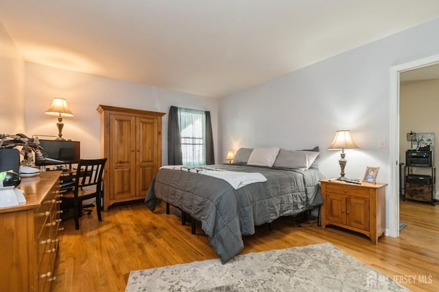 245 S Madison Ave S, Dunellen, NJ 08812 - bedroom with light wood finished floors and an office area