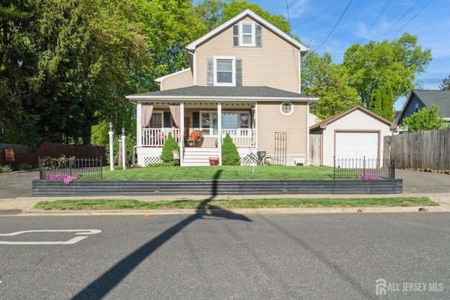 245 S Madison Ave S, Dunellen, NJ 08812 - view of front facade with an outdoor structure, driveway, covered porch, and a garage