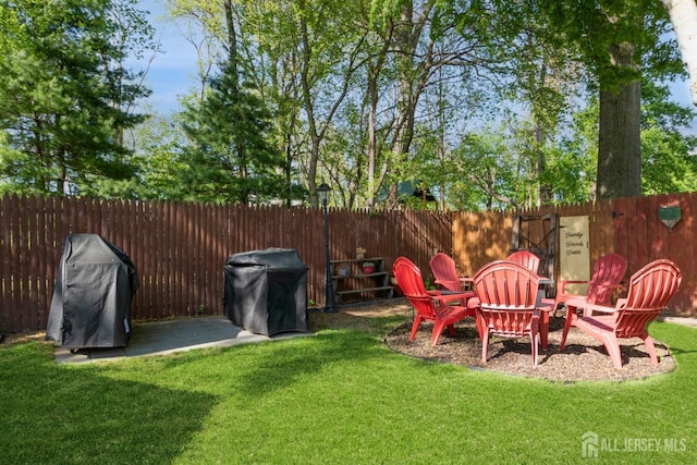 245 S Madison Ave S, Dunellen, NJ 08812 - fenced backyard featuring an outdoor fire pit