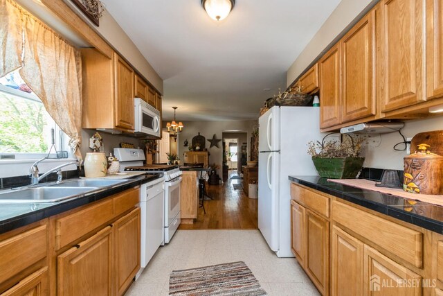 245 S Madison Ave S, Dunellen, NJ 08812 - kitchen with white appliances, healthy amount of natural light, a chandelier, and light floors