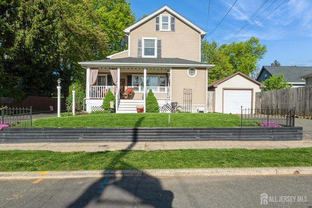 245 S Madison Ave S, Dunellen, NJ 08812 - view of front of property with an outbuilding, covered porch, a detached garage, and driveway